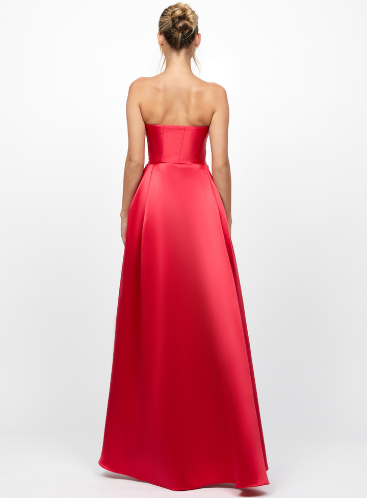 red strapless dress with overskirt