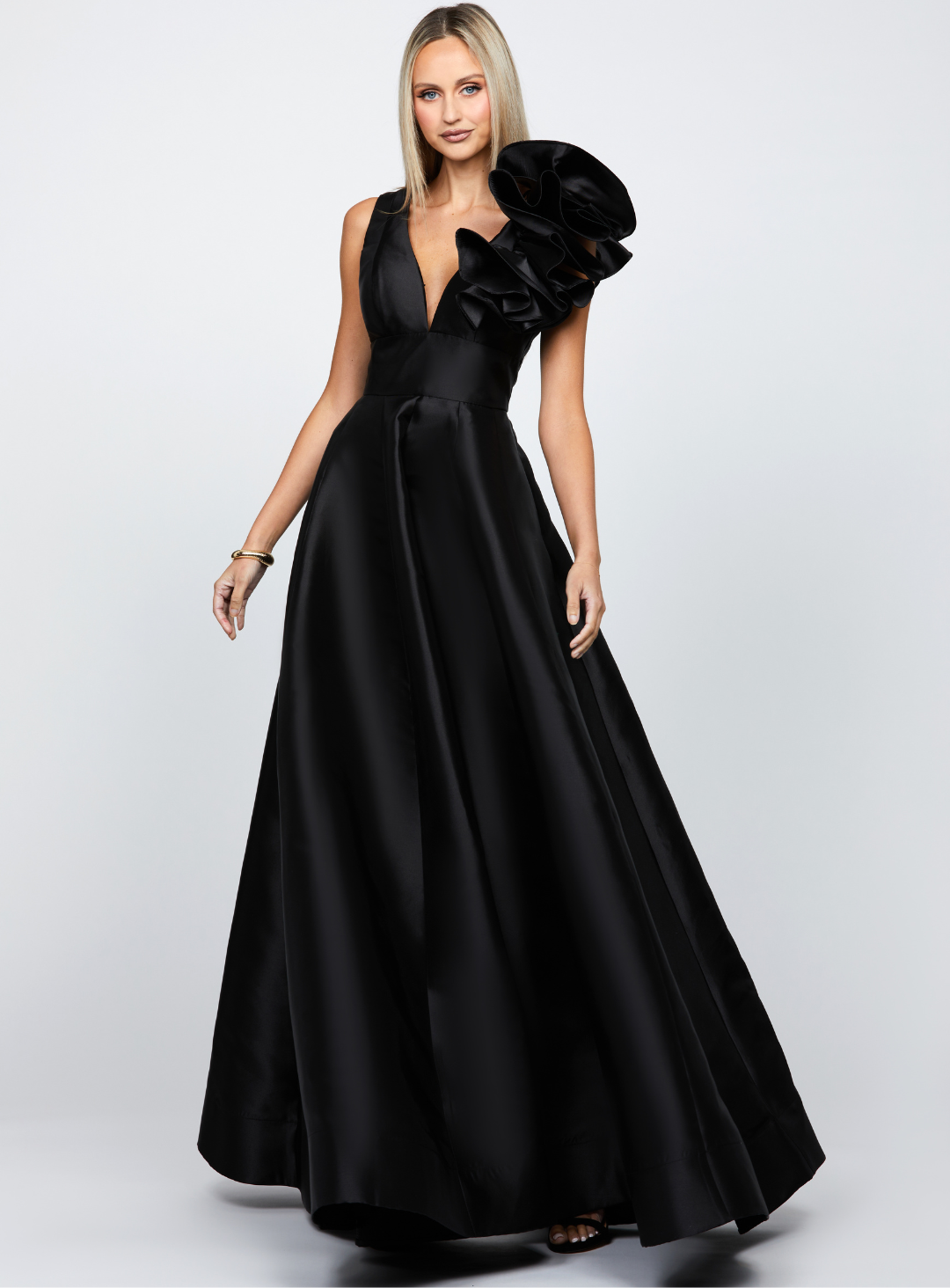 black mirella gown with v-neckline and ruffle shoulder perfect for wedding guests