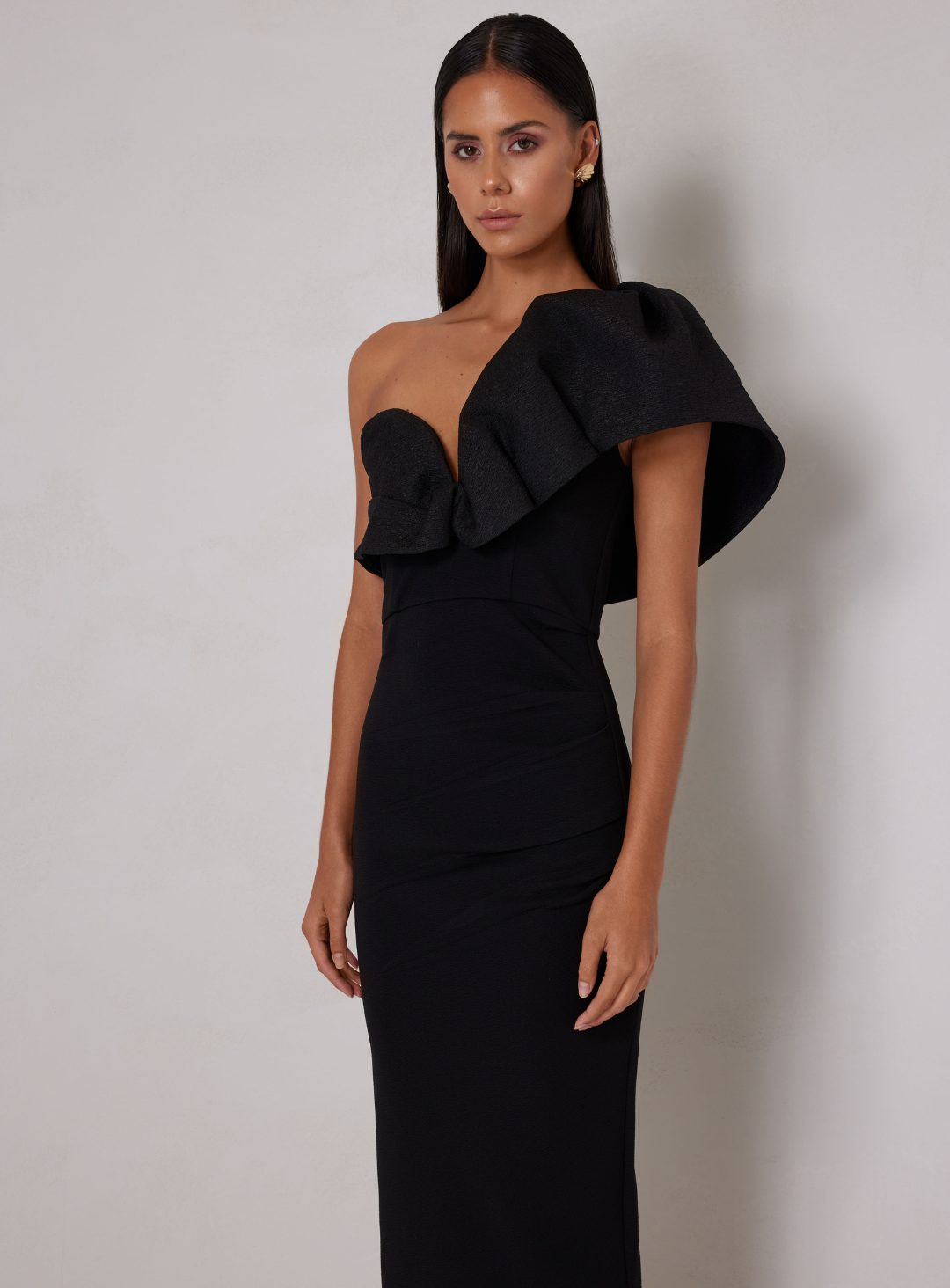 black one shoulder midi wedding guest dress by elle zeitoune