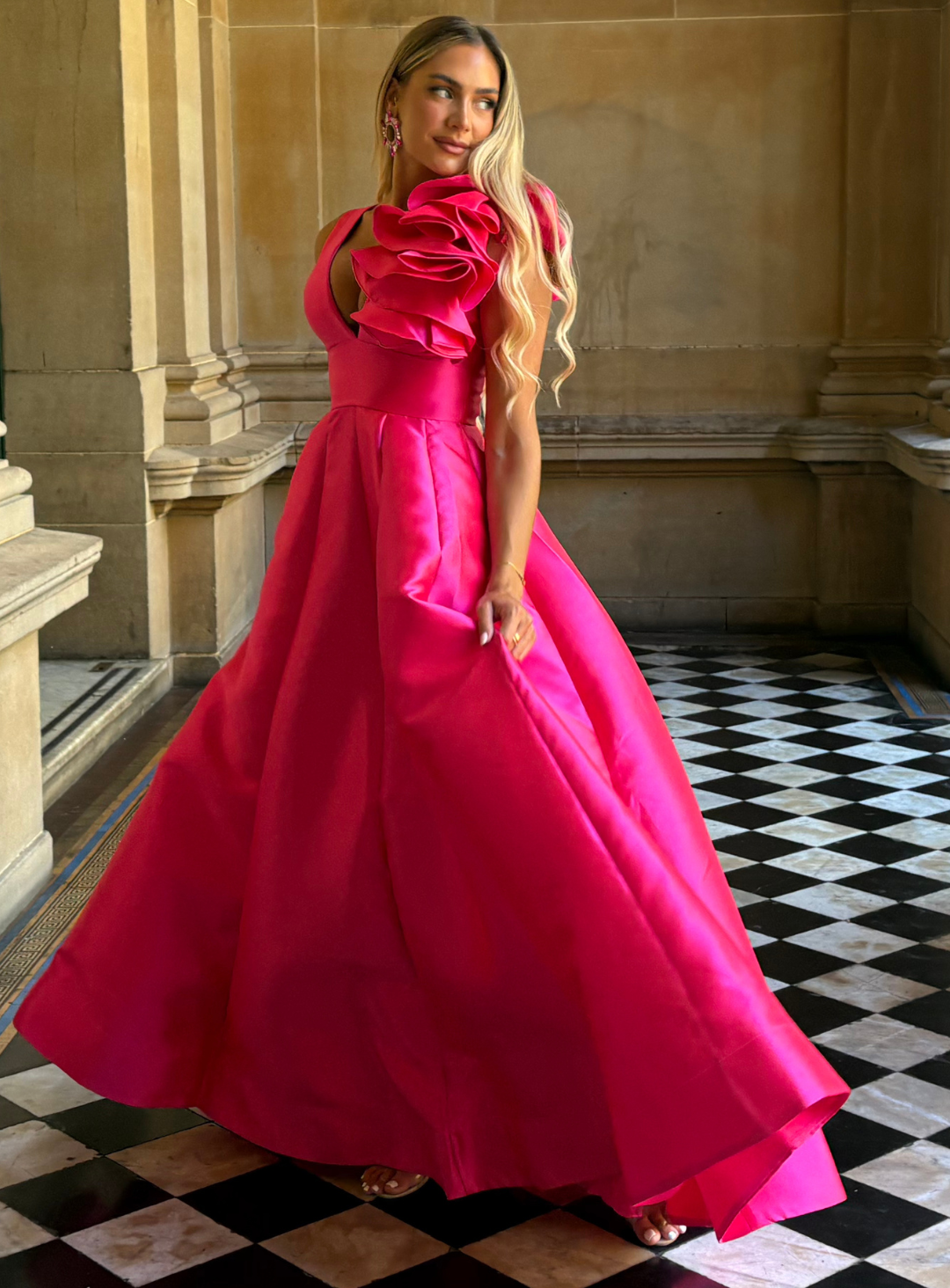 twirl the night away in this hot pink ball gown by bariano