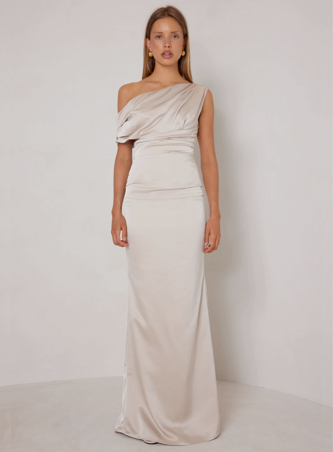 champagne one shoulder bridesmaid dress with off the shoulder detail in satin fabrication