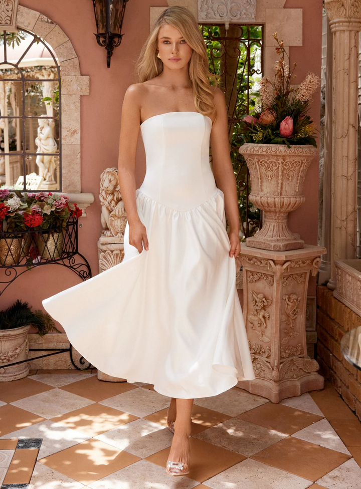 strapless little white dress with drop waist and a-line flared skirt
