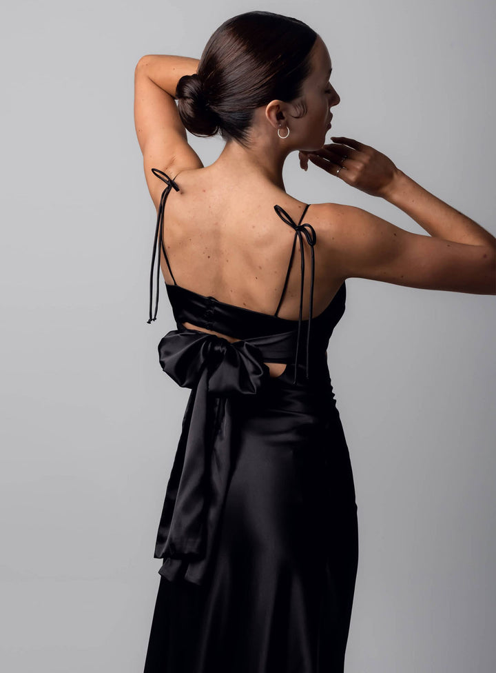 bow detailing on a black satin gown